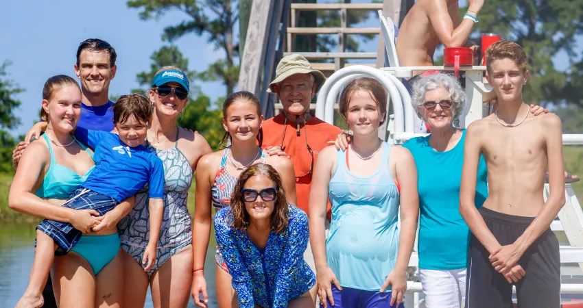 Large family with several members of different ages enjoying time at family camp