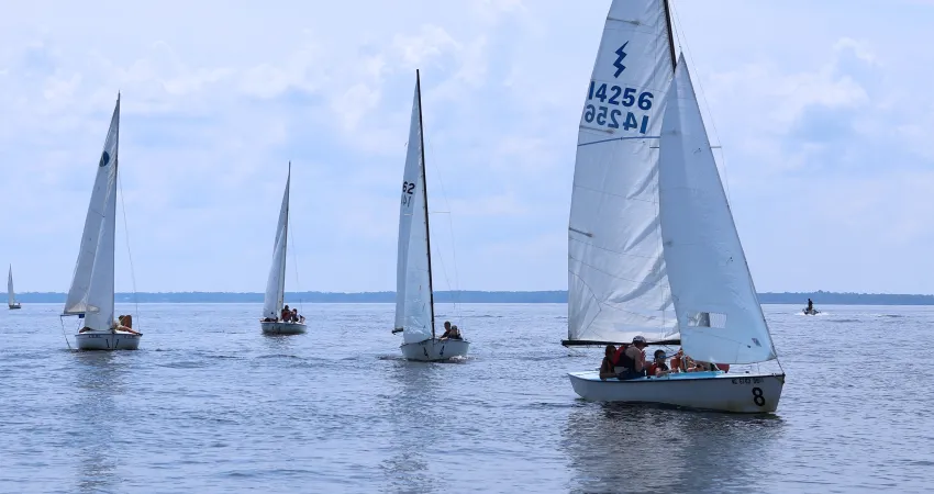Four large sailboats on the water at Camp Sea Gull