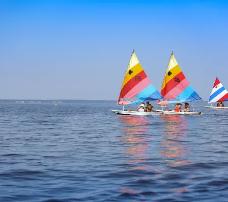 Three sail boats on the water