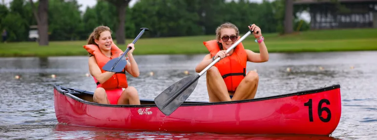 two girls in a canoe