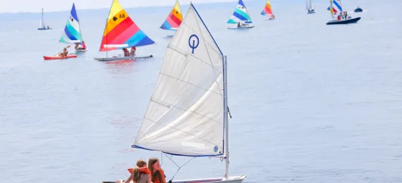 Two girls on an Opti