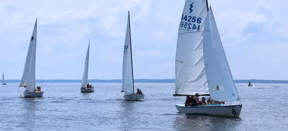 Four large sailboats on the water at Camp Sea Gull