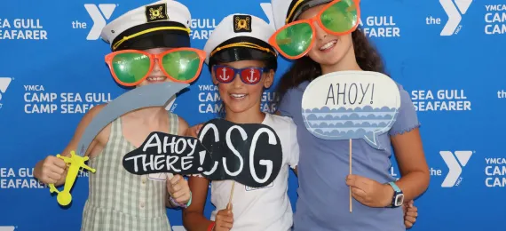 three girls at a Camp Seafarer camper social