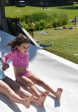 Two girls on the slide at Camp Seafarer